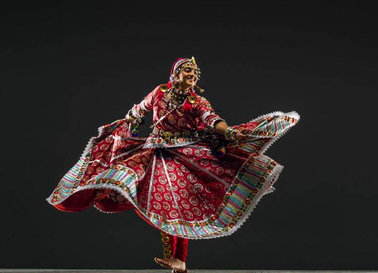 Traditional Rajasthani Ghoomar performance with elaborate costumes